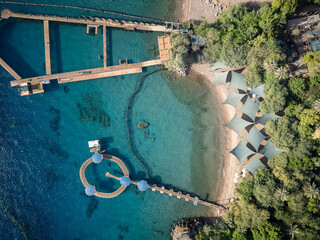 Top View Dolphin Reef is a horseshoe-shaped sea-pen where bottlenose dolphins in the Gulf of Eilat in the northern-eastern Red Sea near the city of Eilat in southern Israel swim in and out of top view