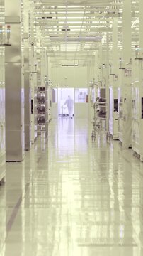 Vertical footage of workers in a Semiconductor manufacturing facility