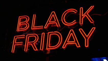 Bold neon 'BLACK FRIDAY' sign glows vibrantly red against a dark night, capturing the electric excitement of major sales events.
