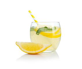 Refreshing lemonade with mint and fruit slices in glass isolated on white