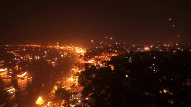Aerial Drone View of Glowing Kashi during Dev Deepawali Night with Ganga River, Boats, and Thousands of Diyas Lighting the Ghats