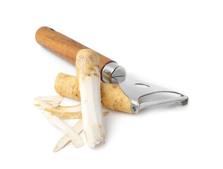 Fresh raw horseradish roots and peeler isolated on white