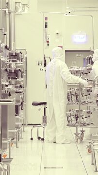 Vertical footage of workers in a Semiconductor manufacturing facility