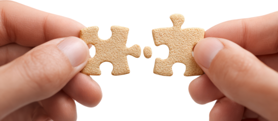 Hands holding jigsaw puzzle pieces with focus, concept of solution