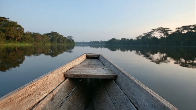 Silent canoe glides through Amazonian dawn, evoking Pachamama reverence and World Wetlands Day's whispered serenity and reflection