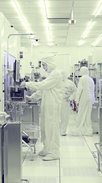 Vertical footage of workers in a Semiconductor manufacturing facility