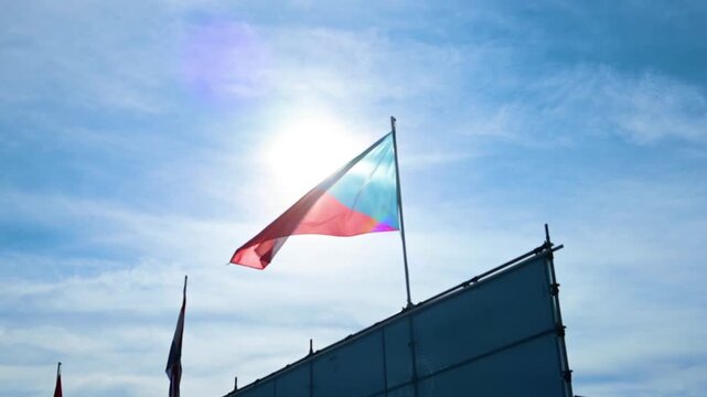 Czech Republic flag waving bright sunlight blue sky