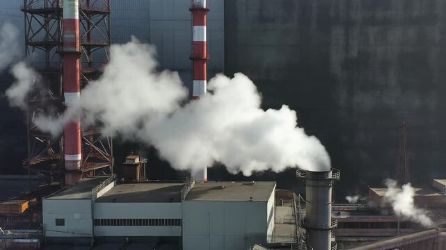Drone Shot of Industrial Plant with Steam Venting Pipe