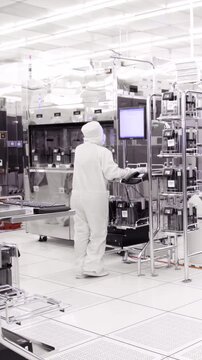 Vertical footage of workers in a Semiconductor manufacturing facility