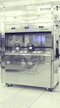 Vertical footage of workers in a Semiconductor manufacturing facility