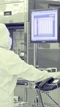 Vertical footage of workers in a Semiconductor manufacturing facility