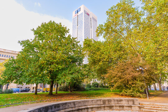 Frankfurt, Germany - October 21, 2025: UBS Tower Amidst Autumn Foliage in Frankfurt, Germany
