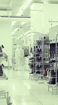 Vertical footage of workers in a Semiconductor manufacturing facility