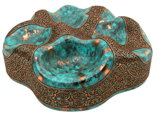 Abstract sculpture bowl made of aged copper with ornate trim on a transparent background