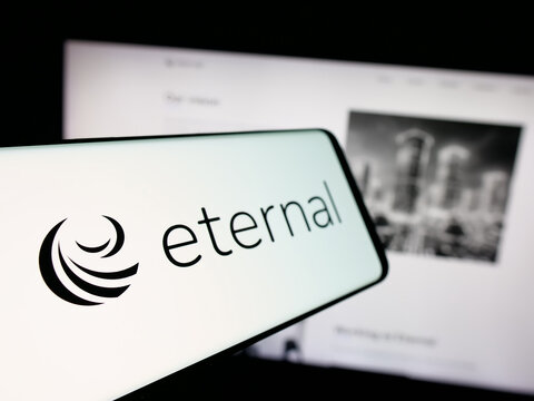 Stuttgart, Germany - 11-02-2025: Smartphone with logo of Indian technology company Eternal Limited on screen in front of website. Focus on left of phone display.
