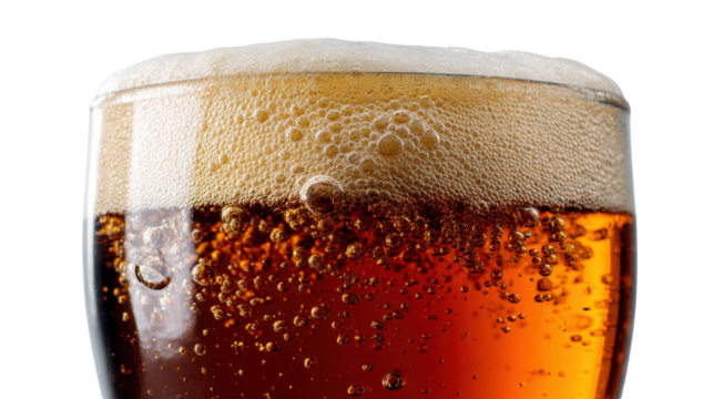 A beer glass filled with a rich amber beer, foam slightly overflowing from the rim, set against a bright that highlights the depth of color in the beer isolated on a Transparent background, PNG file.