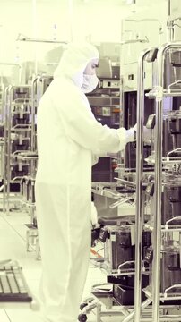 Vertical footage of workers in a Semiconductor manufacturing facility