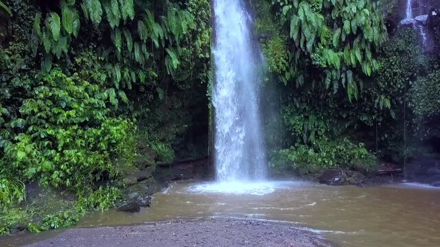 slow motion native natural marvelous aerial view flight pull out drone footage waterfall benang stokel kelambu lombok indonesia 2017 cinematic view from above tourist guide by philipp marnitz