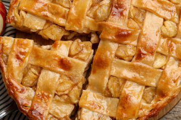 Delicious homemade apple pie on wooden table, top view