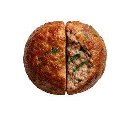 Close up overhead view of a single perfectly cooked golden brown meatball cut in half revealing its savory interior and herbs