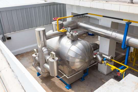 Industrial machinery. Industrial chiller installation. Industrial cooling system. Liquid supply pipe. Mechanism of air conditioning system in industry. Ammonia