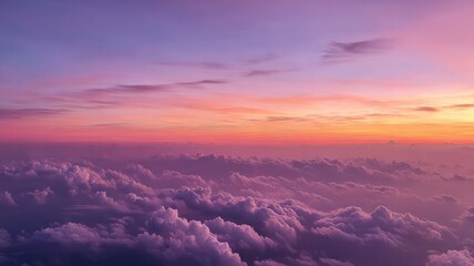 Expansive view of pink and lavender clouds bathed in soft sunrise light. Pastel sky creates serene atmosphere. Captured from aerial perspective. Neural network AI generated