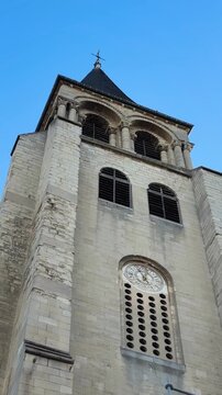 Extreme low-angle vertical view of Saint-Germain-des-Pr&eacute;s Romanesque tower.
