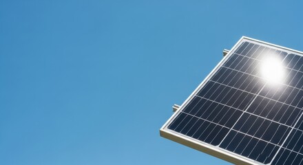 Obraz premium A solar panel gleams in the sunlight against a clear blue sky a symbol of clean energy and a bright future