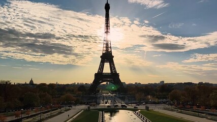 Wide horizontal shot of Eiffel Tower silhouette from Trocadéro at sunset. - Powered by Adobe