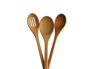 Three natural wood cooking utensils including a slotted spoon and two solid spoons isolated on a transparent background