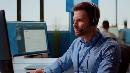 Focused Customer Service Agent Working on Computer Stock Video - Powered by Adobe