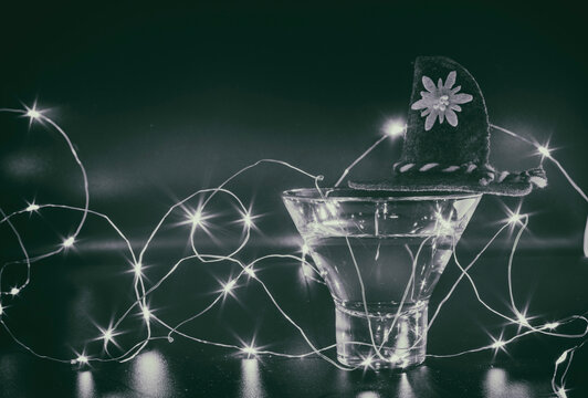 Hat on a martini glass and a garland