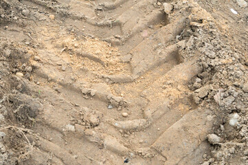 Background from a portion of a truck tire track on a dirt road
