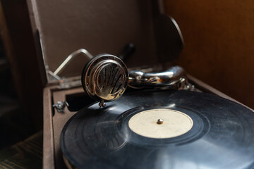 An old record player.Vintage gramophone.Playing music from a record.