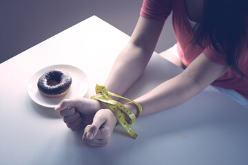 Woman on dieting for good health concept, No Cheat Meal, Stop Eating Junk Food Concept