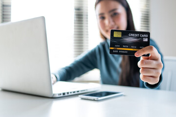 woman makes a purchase on the Internet on the smart phone with credit card, online payment, shopping online, e-commerce, internet banking, spending money