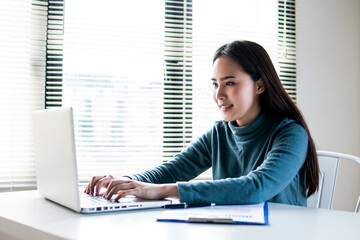 Asian woman working laptop
