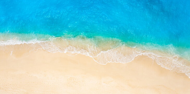 Abstract top view gorgeous tropical beach shore vibrant turquoise ocean water. Aerial expanse white sandy beach bright sunlight Ideal peaceful nature background empty. Summer vacation travel panorama