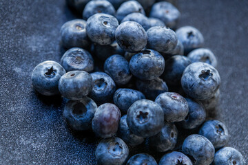 Fresh blueberries in a rustic bowl, homegrown and antioxidant-rich, natural light, cozy seasonal vibes, nutritious fruit, farm-to-table, healthy and vibrant.