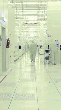 Vertical footage of workers in a Semiconductor manufacturing facility