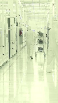 Vertical footage of workers in a Semiconductor manufacturing facility