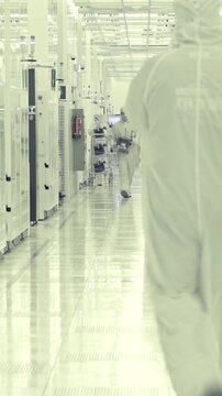 Vertical footage of workers in a Semiconductor manufacturing facility