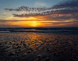 A beautiful summer sunset scenery at the coastline of Baltic Sea. Colorful skies after the sunset in Latvia, Europe.