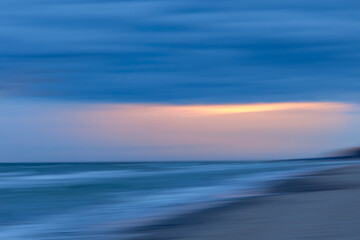 An early morning scenery before sunrise at the beach of Baltic Sea. Summer morning in Latvia, Europe.