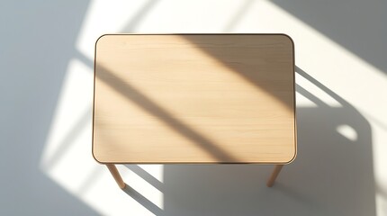 Overhead photo of a small rectangular workstation desk made of laminated light beech wood, isolated on white surface with soft, even studio lighting, gentle drop shadow beneath.