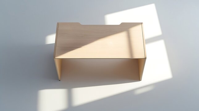 An Overhead photo of a small rectangular workstation desk made of laminated light beech wood, isolated on white surface with soft, even studio lighting, gentle drop shadow beneath.