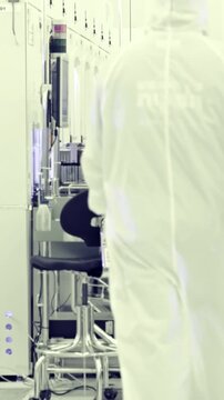 Vertical footage of workers in a Semiconductor manufacturing facility