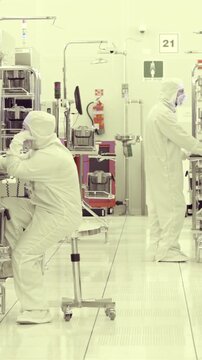 Vertical footage of workers in a Semiconductor manufacturing facility