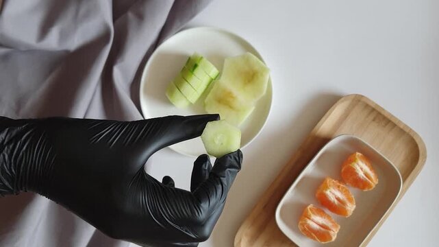 Fresh Green Cucumber Circles Neatly Placed on White Surface