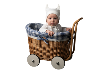 Cute baby in a vintage wicker pram with blue gingham lining
